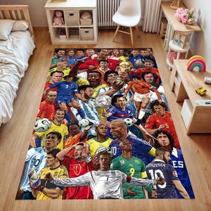 May include: A rectangular area rug featuring a vibrant, multi-colored collage of various professional soccer players in their respective team jerseys, depicted in action poses on a field, with a central golden trophy and several soccer balls.