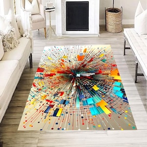 Peut inclure: Un tapis rectangulaire avec un motif abstrait. Le tapis présente une explosion de couleurs au centre, avec des lignes rayonnantes et des formes géométriques rouges, jaunes, bleues et oranges. Le tapis est posé sur un sol en bois clair.
