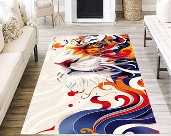 May include: A rectangular rug with a tiger head design. The rug features a white backdrop with a vibrant illustration of a tiger's face in shades of orange, yellow, red, and blue. The rug is placed on a wooden floor.