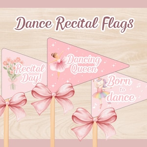 May include: Pink dance recital flags with bows and wooden sticks. Each flag has a different design: flowers, a ballerina, and a unicorn ballerina. Text on the flags reads "Recital Day!", "Dancing Queen", and "Born to dance".