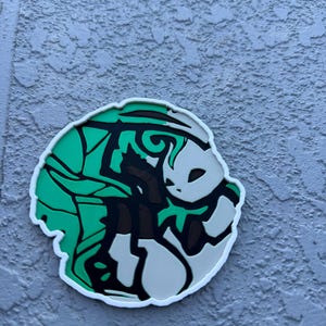 Round Eeveelution coaster Leafeon in cute Pokemon anime art.