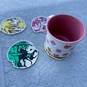Round Eeveelution coaster set featuring Jolteon, Sylveon, Leafeon, Flareon in cute Pokemon anime art.