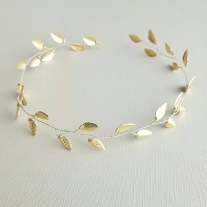 May include: A gold leaf hair vine with delicate leaves, perfect for adding a touch of elegance to any hairstyle.