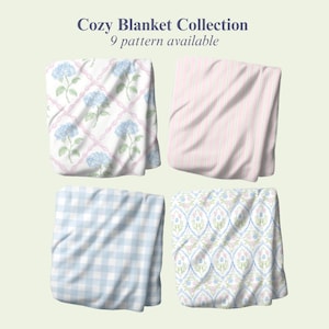 May include: Four folded blankets from the Cozy Blanket Collection, 9 pattern available. Patterns include blue hydrangea flowers on a pink lattice, vertical pink and white stripes, a light blue and white gingham check, and a blue and pink floral damask.