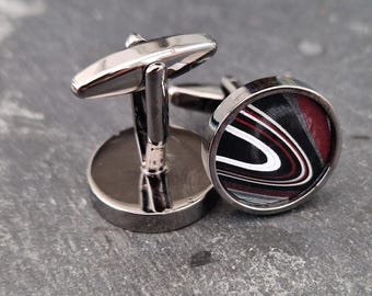 Cufflinks with fordite insert and epoxy resin coating