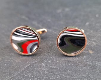 Cufflinks with fordite insert and epoxy resin coating