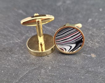 Cufflinks with fordite insert and epoxy resin coating