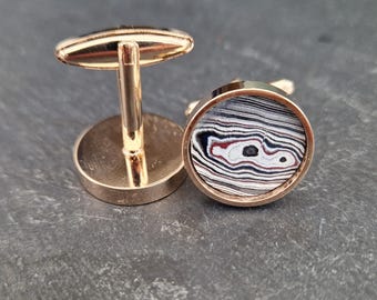 Cufflinks with fordite insert and epoxy resin coating