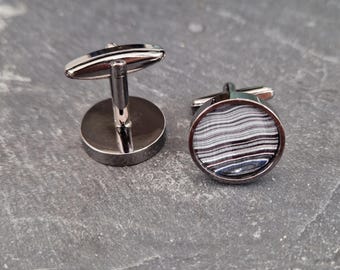 Cufflinks with fordite insert and epoxy resin coating