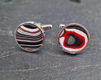 Cufflinks with fordite insert and epoxy resin coating
