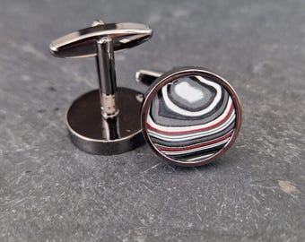 Cufflinks with fordite insert and epoxy resin coating