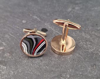 Cufflinks with fordite insert and epoxy resin coating