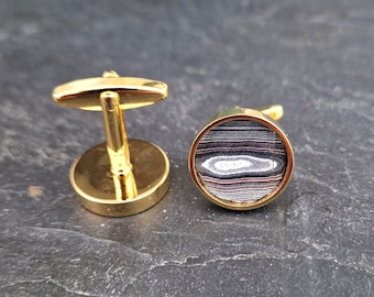 Cufflinks with fordite insert and epoxy resin coating