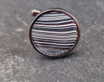 Cufflinks with fordite insert and epoxy resin coating