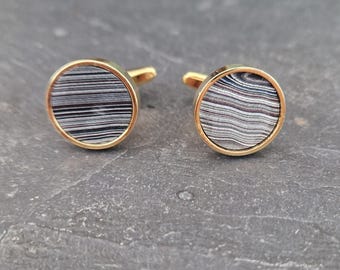 Cufflinks with fordite insert and epoxy resin coating