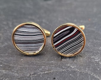 Cufflinks with fordite insert and epoxy resin coating