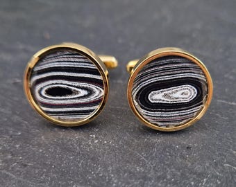 Cufflinks with fordite insert and epoxy resin coating