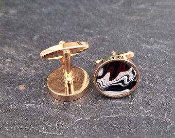Cufflinks with fordite insert and epoxy resin coating