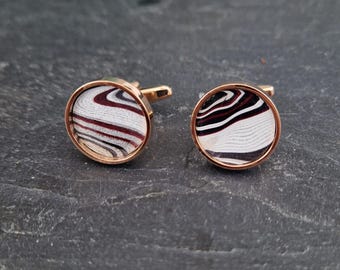 Cufflinks with fordite insert and epoxy resin coating