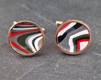 Cufflinks with fordite insert and epoxy resin coating