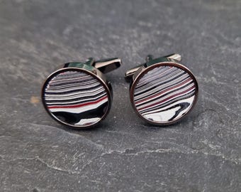 Cufflinks with fordite insert and epoxy resin coating