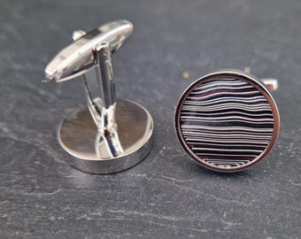 Cufflinks with fordite insert and epoxy resin coating