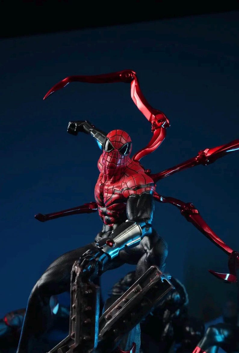 May include: A detailed figurine of Spider-Man in a dynamic pose, featuring a red and black suit with intricate textures. The figure has multiple red mechanical arms extending from its back, set against a dark blue backdrop.