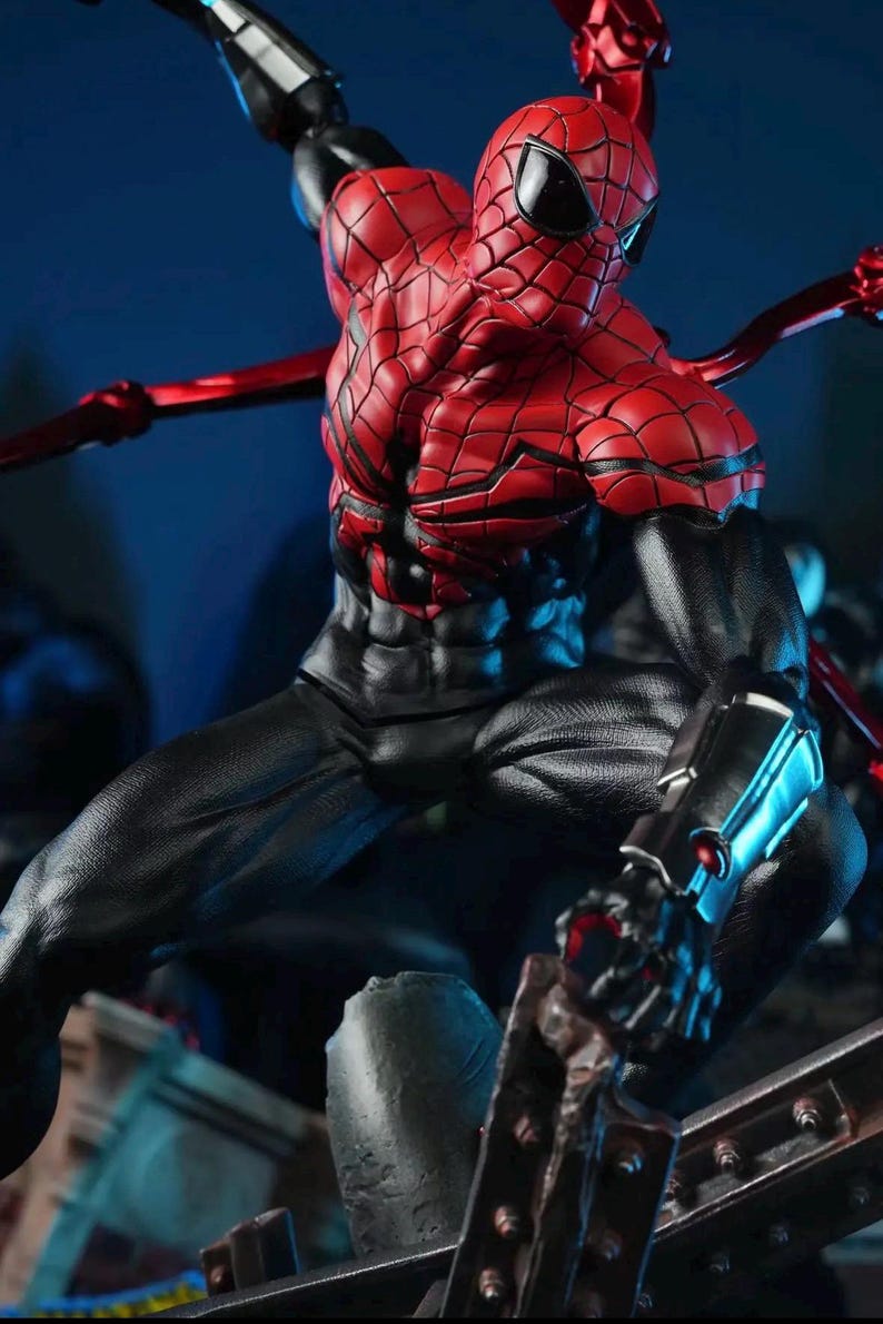 May include: A detailed action figure of Spider-Man in a dynamic pose. The figure features a red and black costume with intricate web detailing. The figure has multiple articulated arms and is set against a dark blue background.