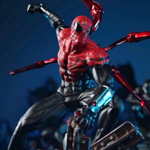 May include: A detailed action figure of Spider-Man in a dynamic pose. The figure features a red and black suit with intricate web detailing, and metallic red mechanical arms extending from the back. The figure is set against a dark blue background.