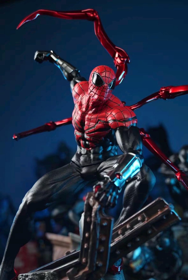 May include: A detailed action figure of Spider-Man in a dynamic pose. The figure features a red and black suit with intricate web detailing, and metallic red mechanical arms extending from the back. The figure is set against a dark blue background.