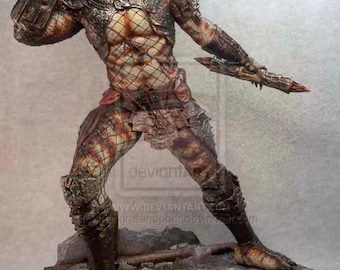 May include: A detailed Predator 2 statue. The figure is in a dynamic pose, with intricate armor and a detailed face. The statue is predominantly brown and tan, with a textured appearance. The base is a circular platform with the words "Predator 2".