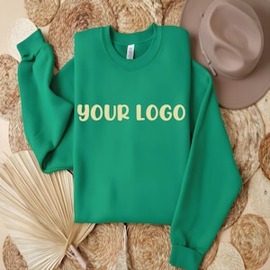 May include: A bright green sweatshirt with the text "YOUR LOGO" printed in a light yellow color on the front.