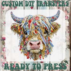 May include: A vibrant image of a Highland cow, featuring floral fabric details. The cow has tan and brown fur, and a pink nose. The image includes the text "CUSTOM DTF TRANSFERS" and "READY TO PRESS" in green.