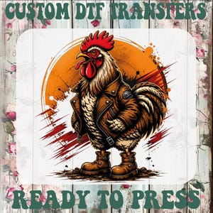 May include: A graphic design featuring a rooster wearing a brown leather jacket and matching boots, set against an orange circular background with paint splatters. The text CUSTOM DTF TRANSFERS and READY TO PRESS appears in green lettering.