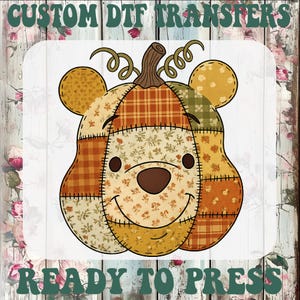 May include: A custom DTF transfer featuring a patchwork pumpkin shaped like a bear head with round ears, a brown stem, and curly vines. The design uses various orange, yellow, and brown fabric patterns with visible stitching. Text reads CUSTOM DTF TRANSFERS READY TO PRESS.