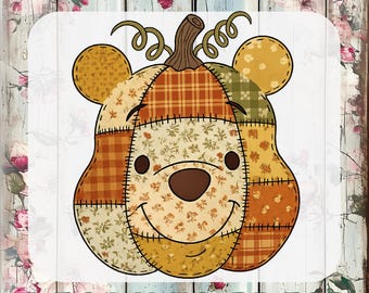 May include: A custom DTF transfer featuring a patchwork pumpkin shaped like a bear head with round ears, a brown stem, and curly vines. The design uses various orange, yellow, and brown fabric patterns with visible stitching. Text reads CUSTOM DTF TRANSFERS READY TO PRESS.