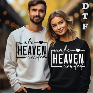May include: A light gray sweatshirt with black text reading make HEAVEN crowded and a black heart, and a black sweatshirt with white text reading make HEAVEN crowded and a white heart. The text DTF is visible in the upper right corner.