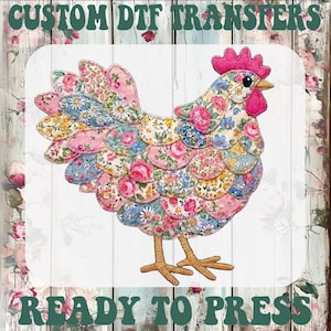 May include: A colorful floral rooster design, ready to press. The rooster is made of fabric with pink, blue, and yellow floral patterns. The image includes the text "CUSTOM DTF TRANSFERS" and "READY TO PRESS" in a green font.