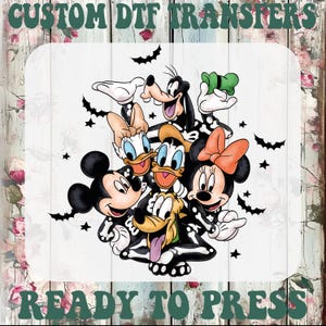 May include: A custom DTF transfer featuring a group of cartoon characters wearing black skeleton costumes with white bone details. The characters include Mickey, Minnie, Donald, Daisy, Goofy, and Pluto, surrounded by black bats and stars.