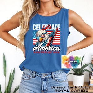 May include: Royal Caribe blue unisex tank top with a patriotic graphic. The graphic features an eagle wearing sunglasses in front of an American flag, with the words "Celebrate America 4th of July".