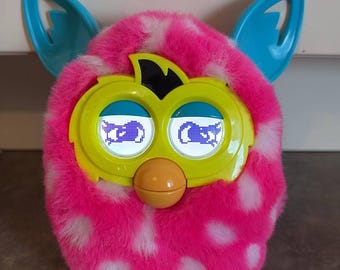 珍しいピンクとベージュのファービー偽物。美しい目の色で動作せ
