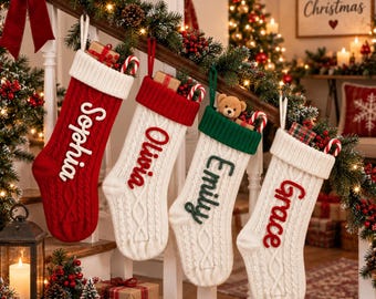 May include: Four personalized Christmas stockings hanging on a staircase railing. The first is red with white trim and the name Sophia. The second is white with red trim and the name Olivia. The third is white with green trim and the name Emily. The fourth is white with red trim and the name Grace. Each stocking features a cable knit pattern and a small gift.