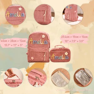 May include: A pink corduroy backpack and matching lunch bag set. The backpack measures 15.7" x 11" x 5" and features the name "Amelia" in colorful embroidery, along with a flower and the number "1". The lunch bag also has "Amelia" embroidered on it.