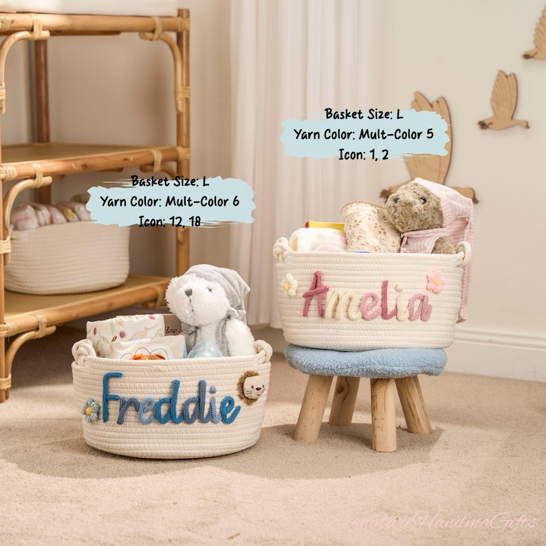 May include: Two white rope baskets, one with "Freddie" in blue and a lion icon, the other with "Amelia" in pink. Both are filled with items and a stuffed animal. The baskets are on a light-colored surface.