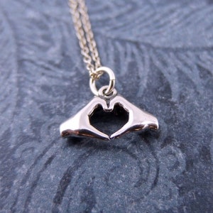Hand heart necklace discount