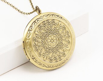 Genuine 14K Yellow Gold Round Locket with Embossed Flower Design LK544 Genuine 14K Yellow Gold Round Locket with Embossed Flower Design LK544