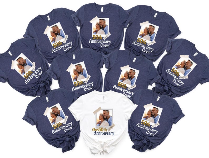 May include: A collection of navy blue and white t-shirts. Each shirt features a printed photograph of a couple and the text "50th Anniversary Crew". The white shirt has the text "Our 50th Anniversary".