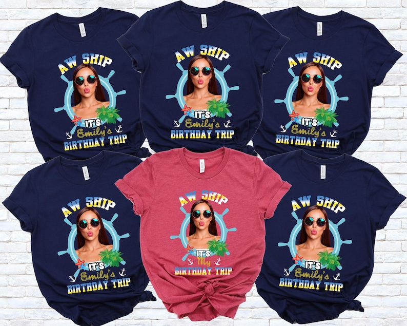 May include: Navy blue and red t-shirts with a graphic featuring a woman in sunglasses, a ship's wheel, and the text "AW SHIP, It's Emily's Birthday Trip." The shirts are short-sleeved and suitable for a birthday celebration.