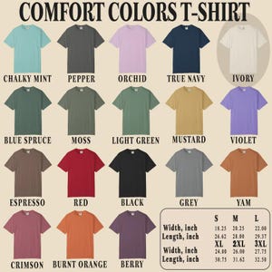 以下が含まれることがあります： Chalky Mint、Pepper、Orchid、True Navyなど、さまざまな色のComfort Colors Tシャツのディスプレイ。画像には、幅が46.35 cmから70.49 cm、長さが67.62 cmから82.55 cmのインチ単位のサイズチャートが含まれています。