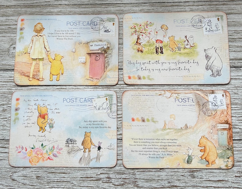 May include: Set of four Winnie the Pooh themed postcards with vintage-inspired illustrations and quotes. The postcards feature Winnie the Pooh and Piglet in various scenes, including walking in the woods, playing with a balloon, and sitting on a bench. Each postcard has a different quote from the Winnie the Pooh stories.